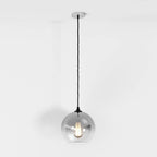 Clérachic silver-finish glass sphere pendant shown at full drop length, filament bulb lit on a white ground.
