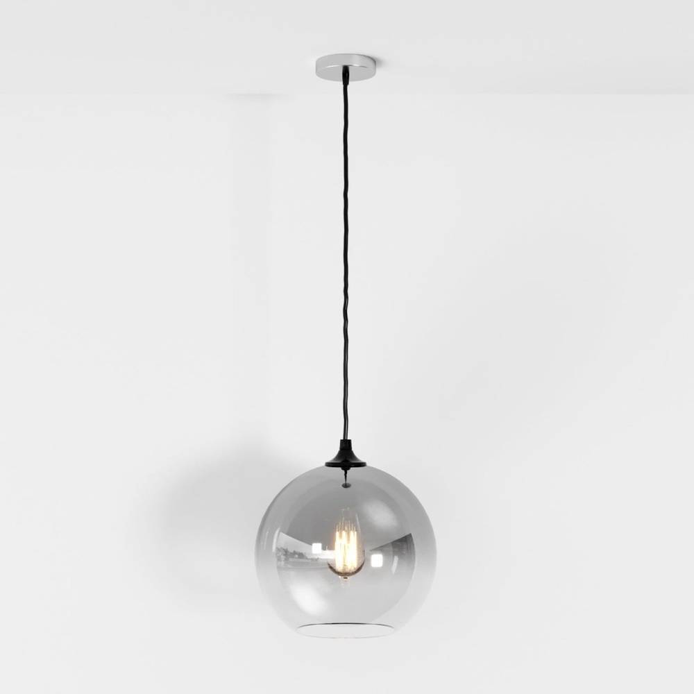 Clérachic silver-finish pendant light with gradient glass sphere shade, filament bulb glowing on white backdrop.