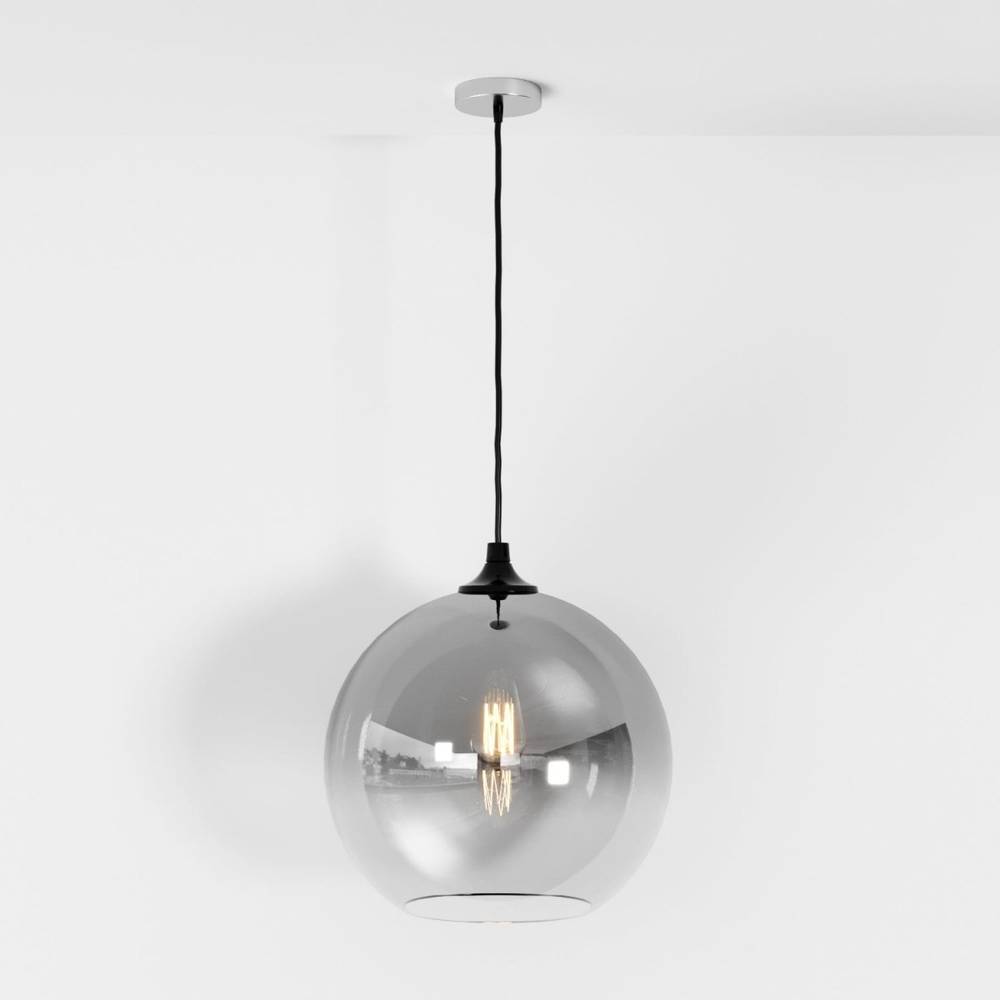 Clérachic silver-finish glass sphere pendant on a black cord, warm filament bulb glowing on white backdrop.