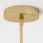 Clérachic close-up of the champagne ceiling canopy and cord fitting, shown against a plain white backdrop.
