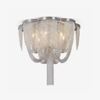 Semi-flush Clérachic ceiling light with silver chains draped in swags and a long central tassel, on a plain white backdrop.