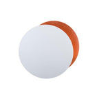 White front disc over an orange-copper disc on this Clérachic wall light, centred on a white backdrop.