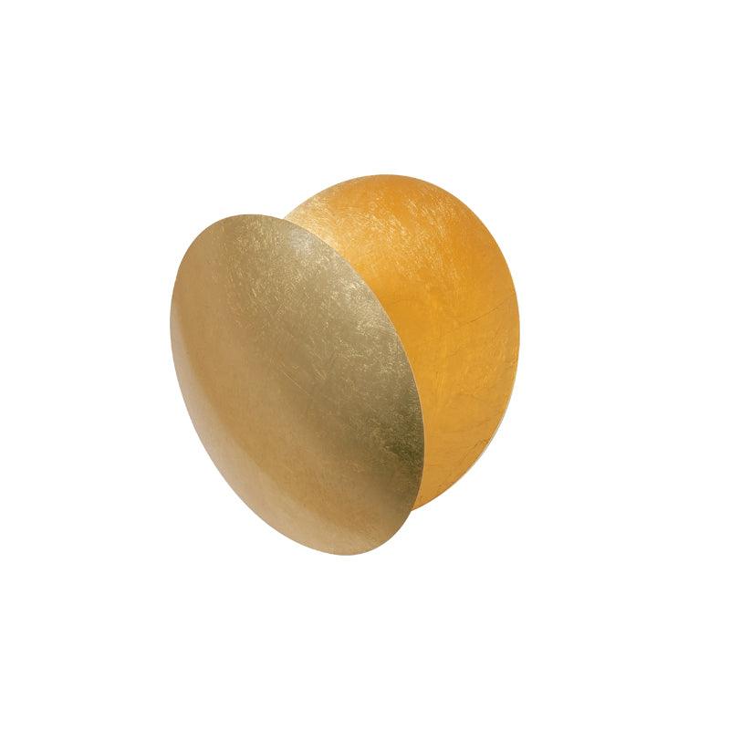 Angled view of this Clérachic wall light in gold, the front disc tilted out to show a deeper amber disc behind it, on white.