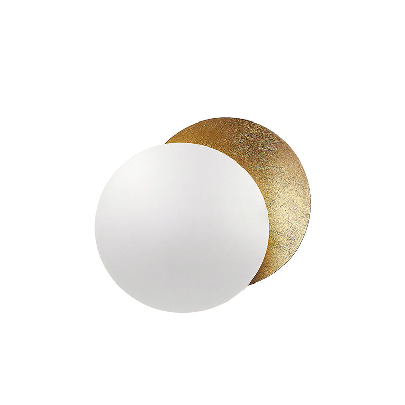 White front disc over a gold-leaf disc on this Clérachic wall light, with the gold peeking out behind, on white.