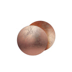 Rose-copper front disc with fine cracks over a darker copper disc on this Clérachic wall light, on a white backdrop.
