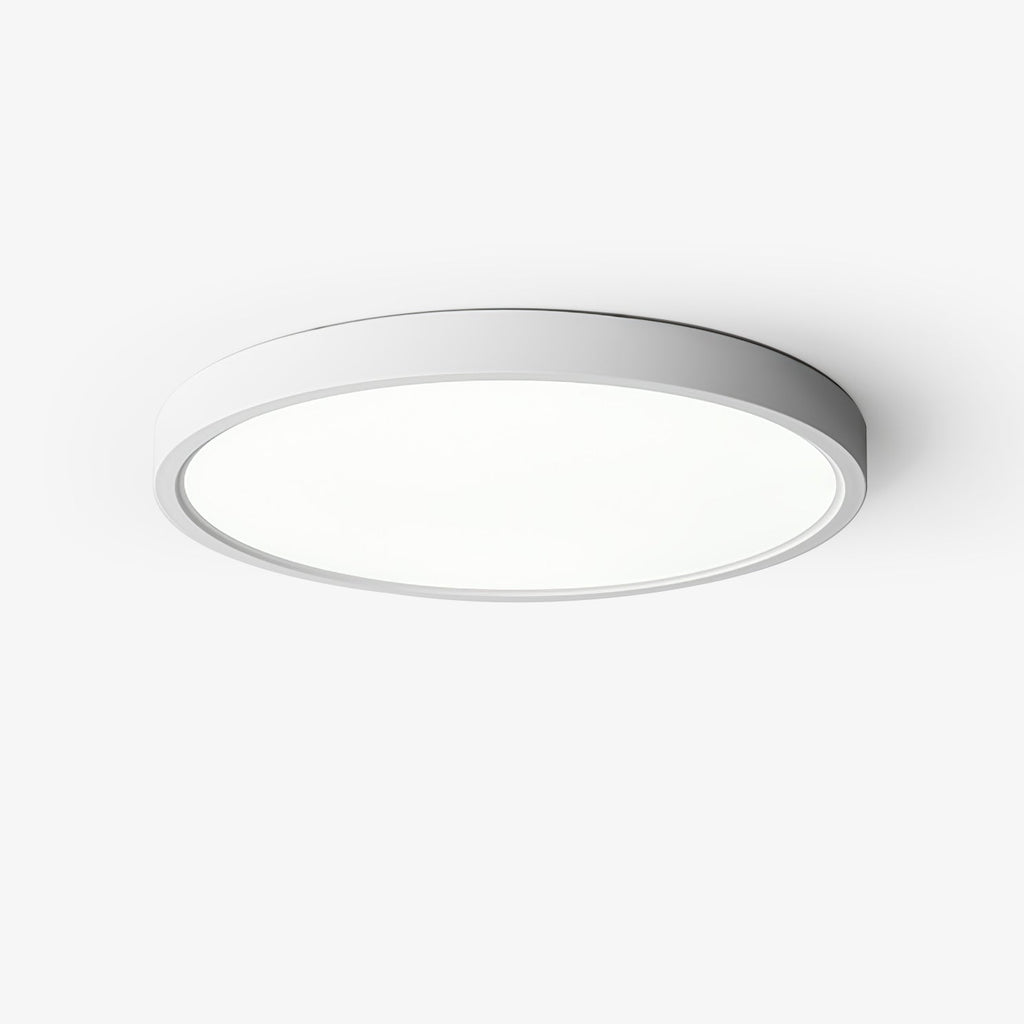 This Clérachic slim round ceiling light has a white metal rim and a flat white acrylic diffuser, seen from below on a pale backdrop.