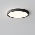 A black Clérachic round ceiling light with a softly lit diffuser, viewed at an angle to show the depth of its slim rim.