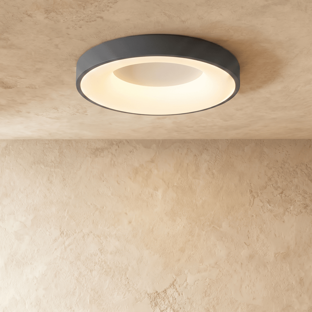 Clérachic largest grey round ceiling light in the range, its warm inner ring glowing against pale plaster.