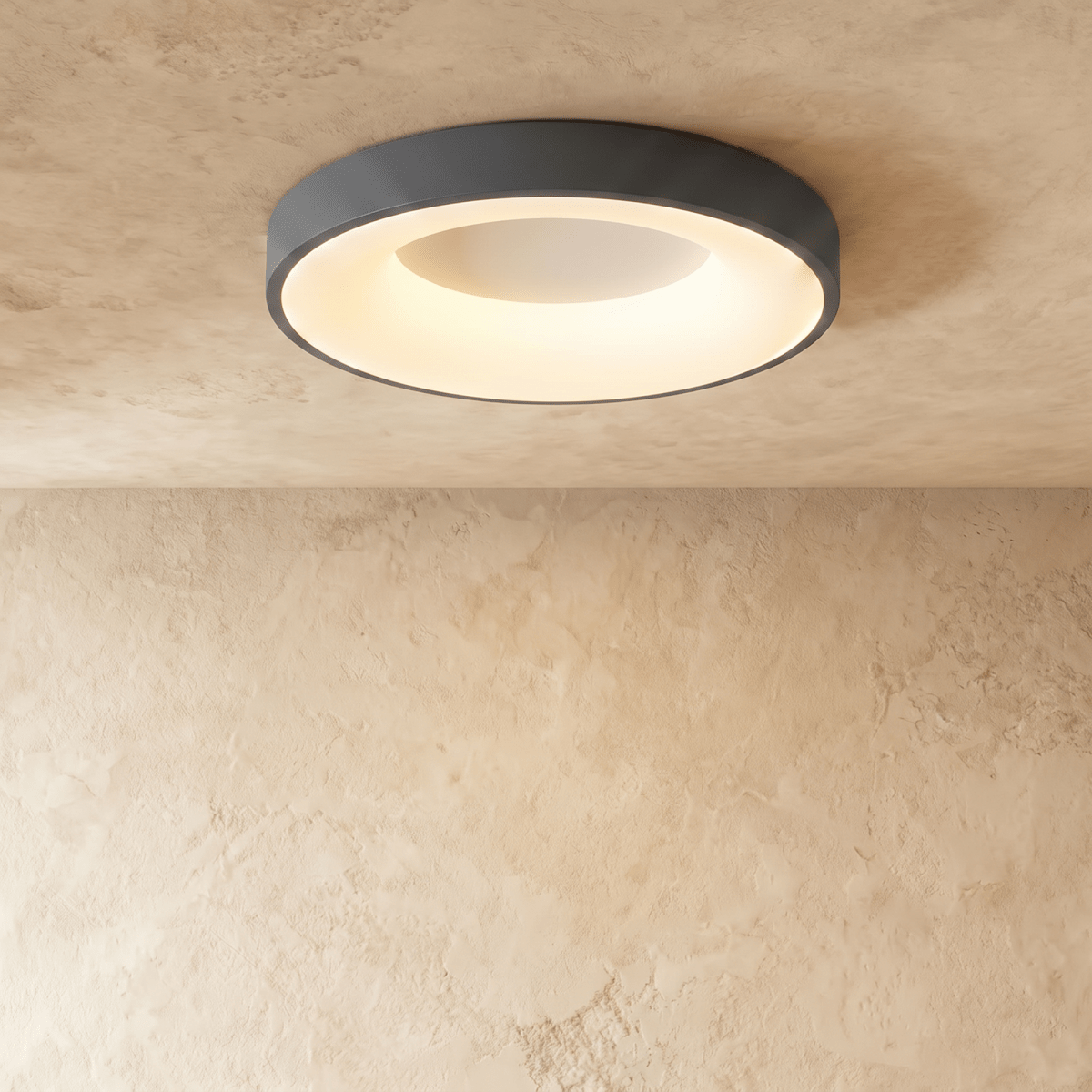 Clérachic largest grey round ceiling light in the range, its warm inner ring glowing against pale plaster.