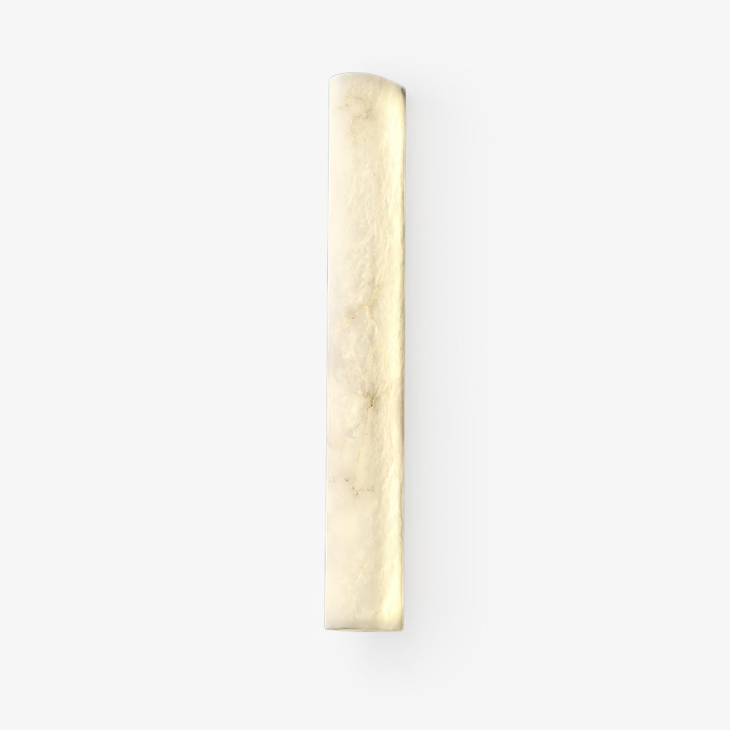 Slim half-cylinder alabaster wall sconce from Clérachic, glowing softly with cloudy cream veining, on a plain white backdrop.