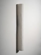Wide half-round alabaster sconce on a pale wall, unlit, showing its gentle curve and the shadow on the left; from Clérachic.