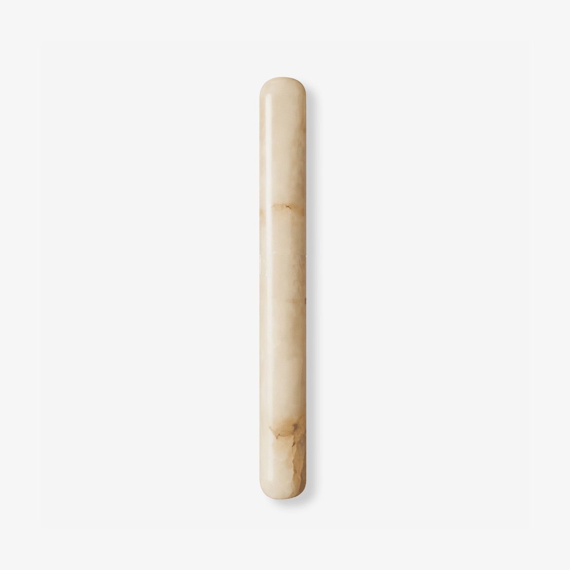 Slim Clérachic wall light in white alabaster with soft honey veining, a rounded-end cylinder shown on a plain white backdrop.