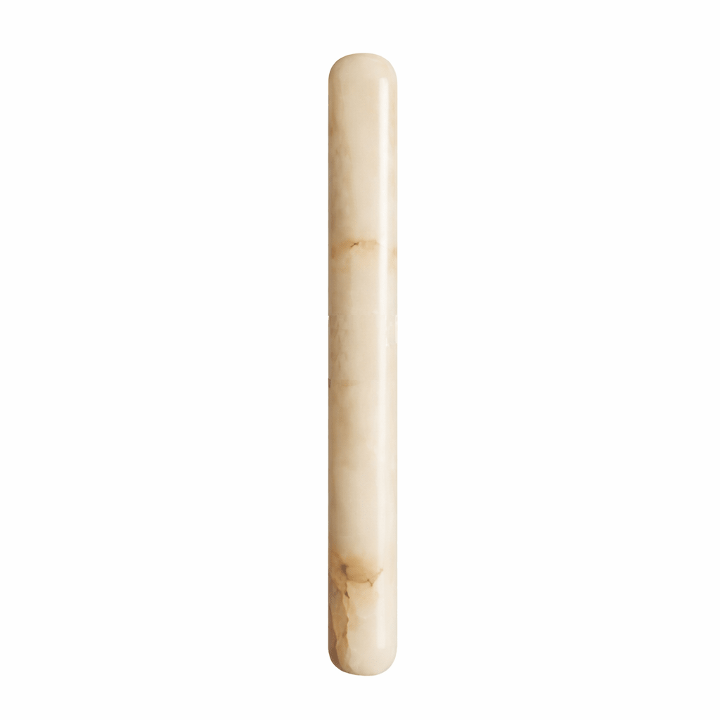 Slim Clérachic alabaster wall light on a white backdrop, showing the cream stone with caramel veining and rounded ends.
