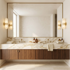 Two pairs of Clérachic alabaster wall lights beside a large mirror above a marble vanity with a walnut cabinet.