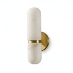 Clérachic alabaster wall light in a brass and white finish, seen from the side on a plain white background.