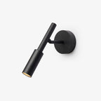 A black Clérachic wall light with a slim tube spot head on a short arm and a round backplate, on a white backdrop.