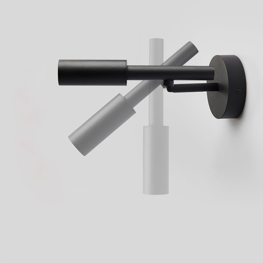 A black Clérachic wall light shown swung through its range, from hanging down to pointing out level from the wall.