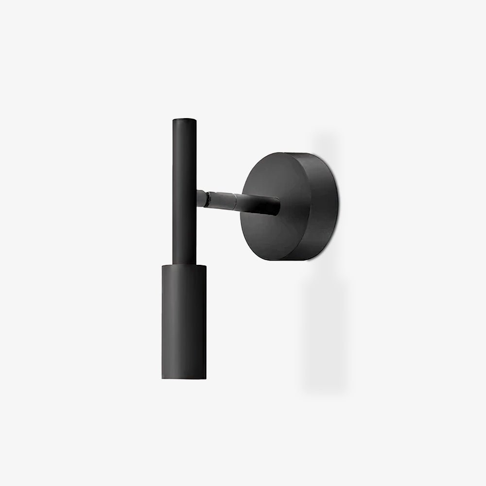 A black Clérachic wall light with a round backplate and a vertical tube head, on a plain white background.