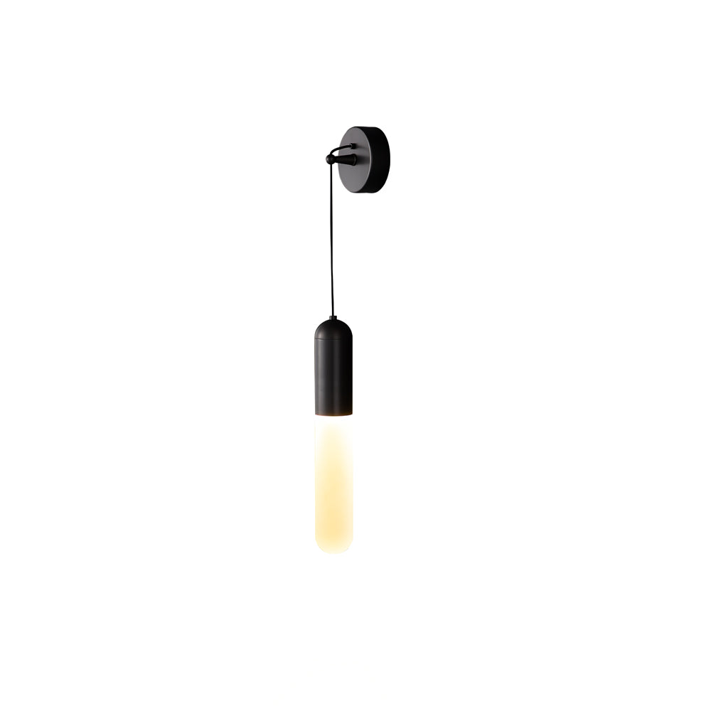 Cut-out view of this black Clérachic wall light on white, a black cap and wall plate above a faintly lit cylinder shade.