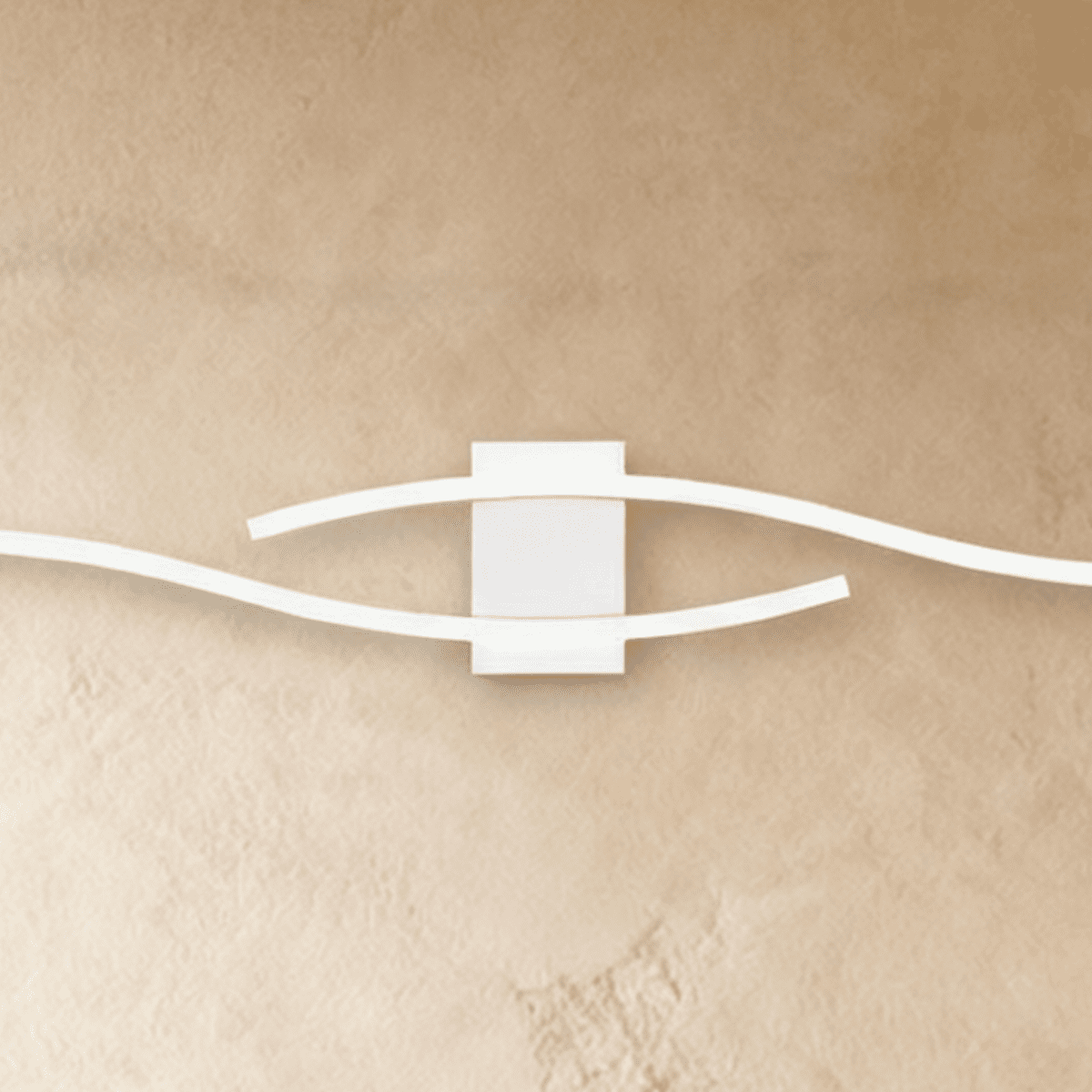 Close view of the Clérachic white wall lamp's square backplate with two wavy slim bars sweeping past each other.