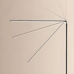 The black light bar of this Clérachic floor lamp is shown in a fan of angles, from horizontal to steeply raised, against a cream wall.