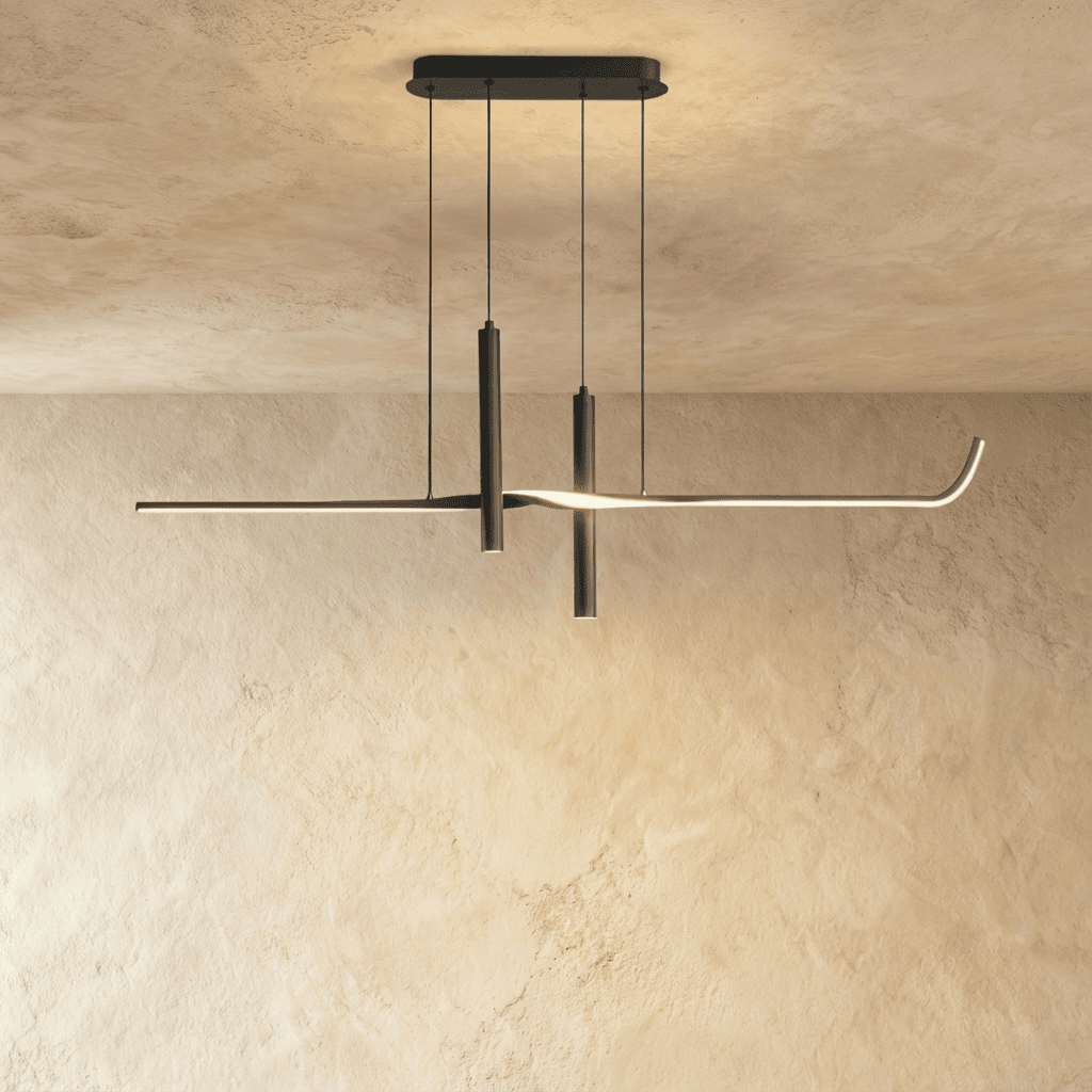 Clérachic black linear pendant switched on, a soft line of warm light running along the arm and from the two spotlight tubes.