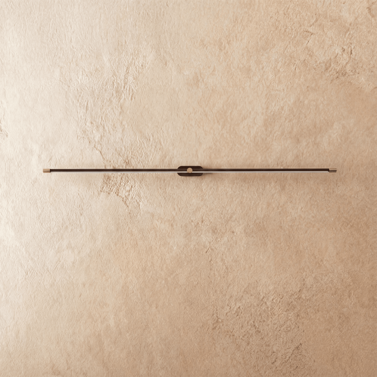 Clérachic ultra-slim linear wall light switched off, a black aluminium bar with gold end caps on textured plaster.