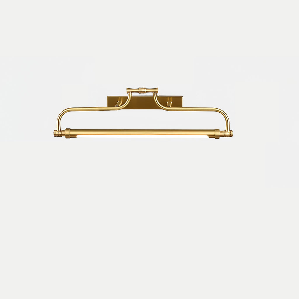 A Clérachic wall light in a bright gold finish on a pale grey backdrop, with its tube glowing softly.