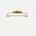 A Clérachic wall light in a bright gold finish on a pale grey backdrop, with its tube glowing softly.
