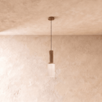 Clérachic slim pendant with a fluted brass-toned body and a ribbed clear glass shade on a thin cord, 30 cm tall
