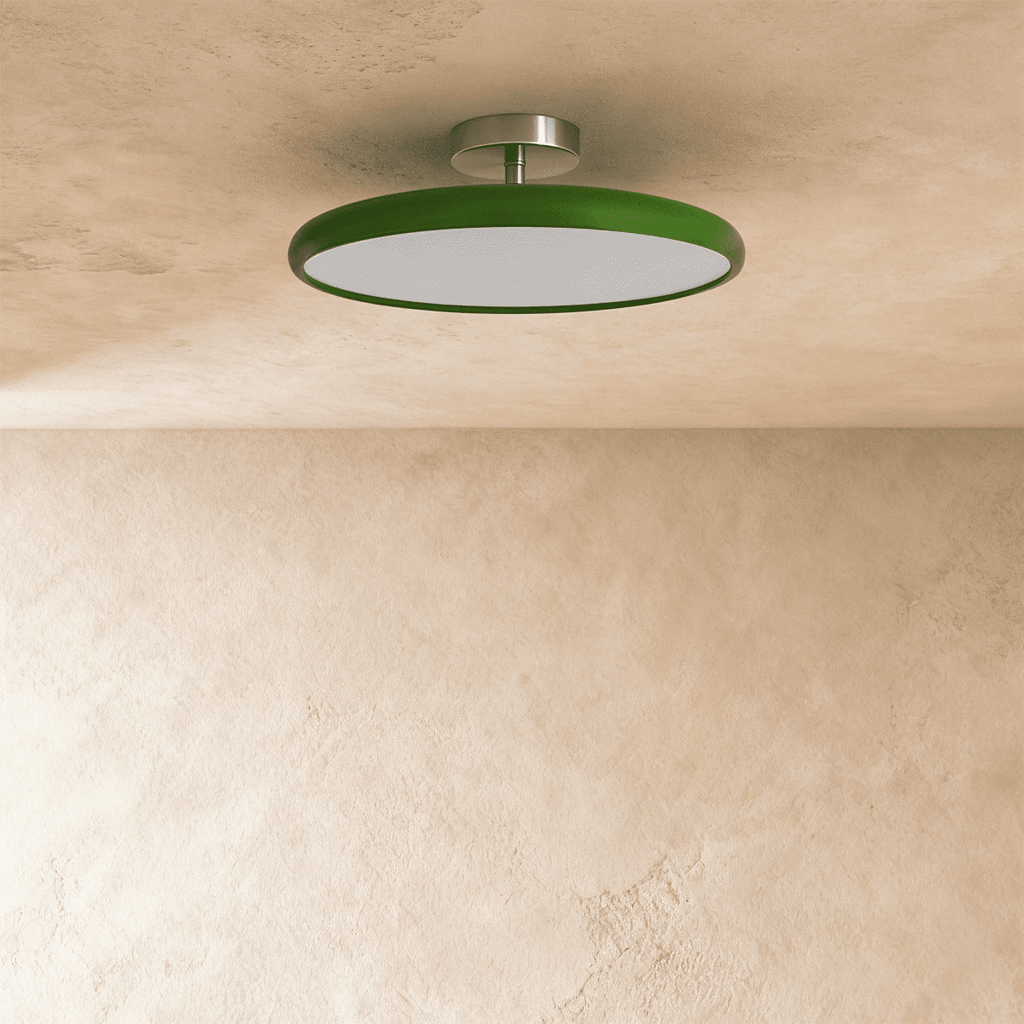 Clérachic glossy green round ceiling light switched off, with a flat white diffuser and a short brushed metal stem.