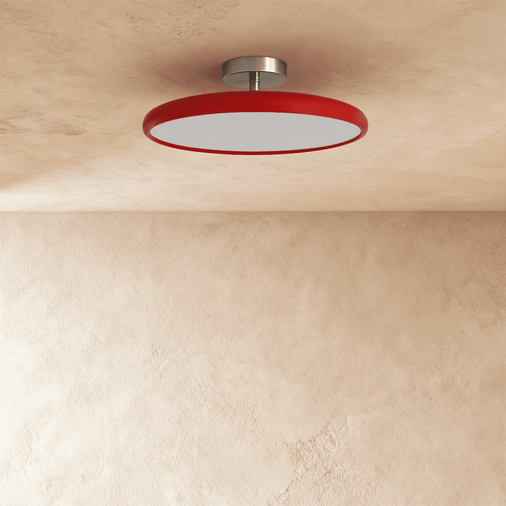 Clérachic glossy red round ceiling light switched off, showing the flat white diffuser and brushed metal canopy.