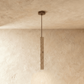 Clérachic slim stone-look cylinder pendant hanging on a thin rod from a bronze canopy, shown in a shorter length.