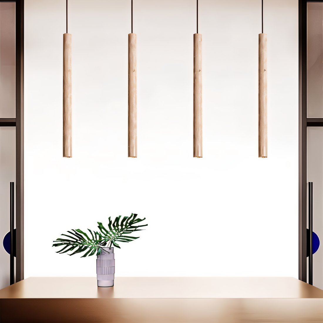 Clérachic four slim stone-look cylinder pendants in a straight row above a table with a leafy stem in a vase.