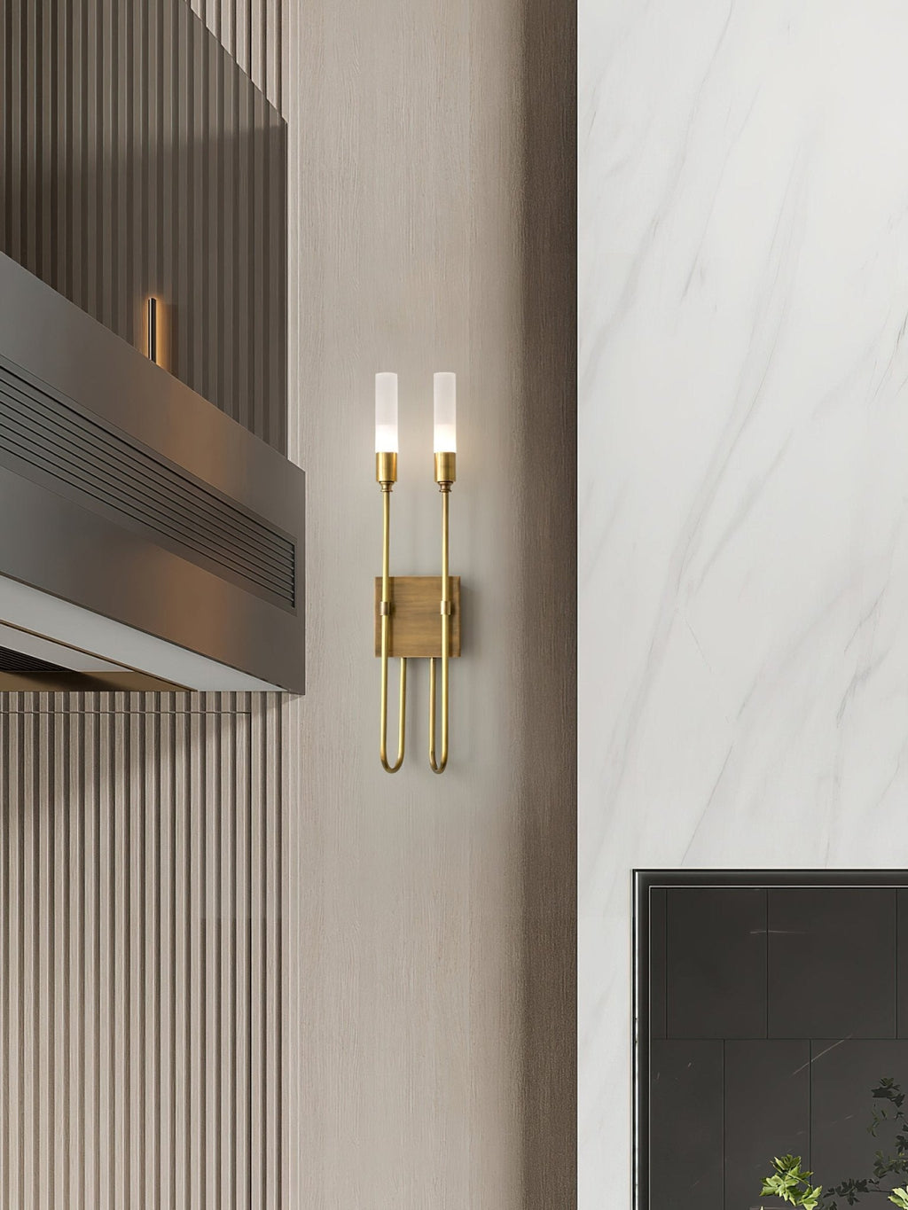 Small brass two-light Clérachic sconce on a pale panelled wall beside a marble-look surface and a dark vent, shown from a distance.