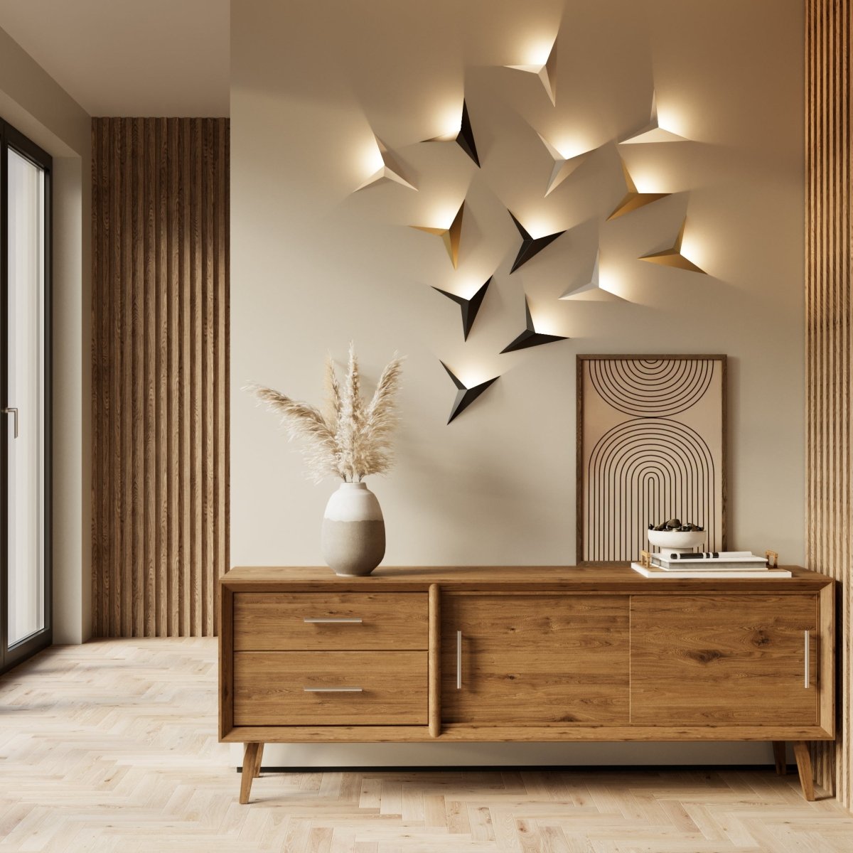 A cluster of Clérachic slim iron wall sconces in mixed finishes lights a hallway wall above a wooden credenza.
