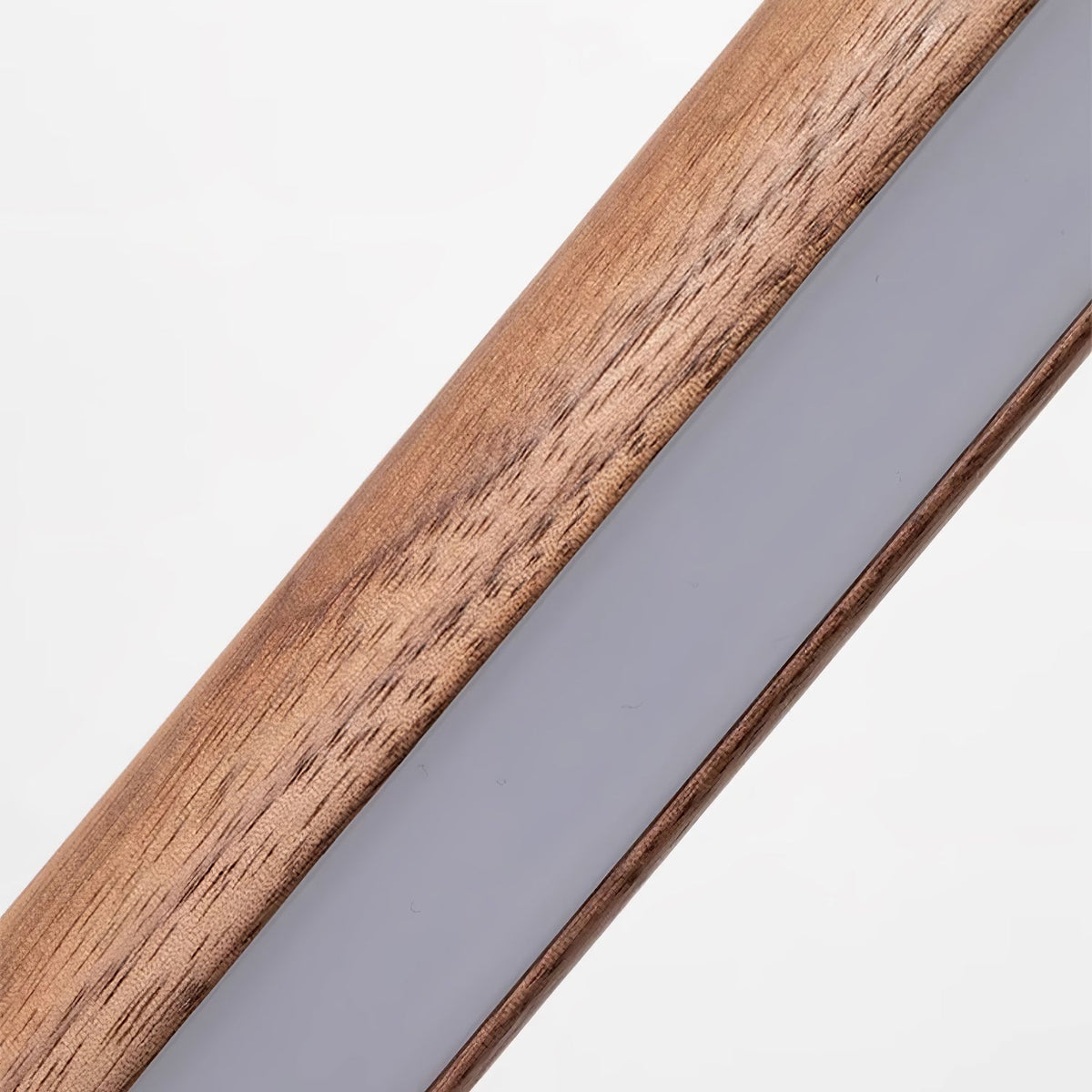 Close-up of the walnut grain and the frosted LED strip set into the body of this Clérachic floor lamp.