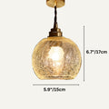 Clérachic crackle-glass dome pendant with a brass holder on a twisted cord, measuring 15 cm wide and 17 cm high.