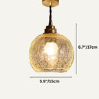 Clérachic crackle-glass dome pendant with a brass holder on a twisted cord, measuring 15 cm wide and 17 cm high.