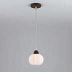Clérachic fluted pendant lamp with a dark walnut-toned cap and matching ceiling plate, its white ribbed shade on a pale cord.