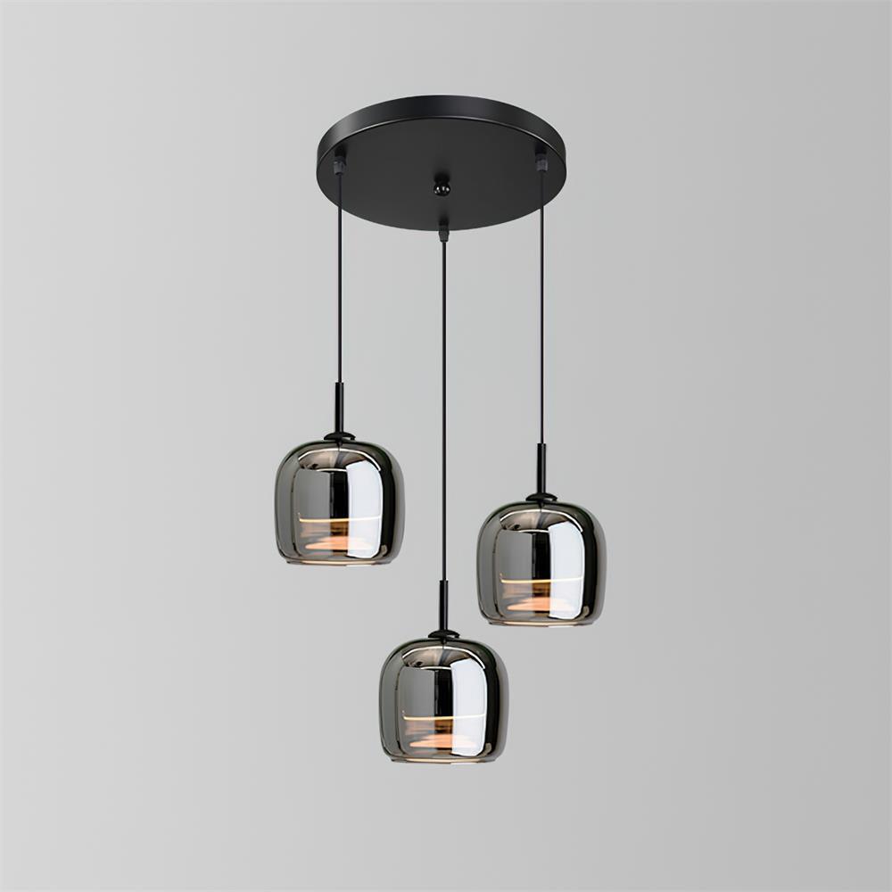 The Clérachic pendant in its round-cluster version, three smoke gray glass domes dropped at staggered heights from a black disc canopy.