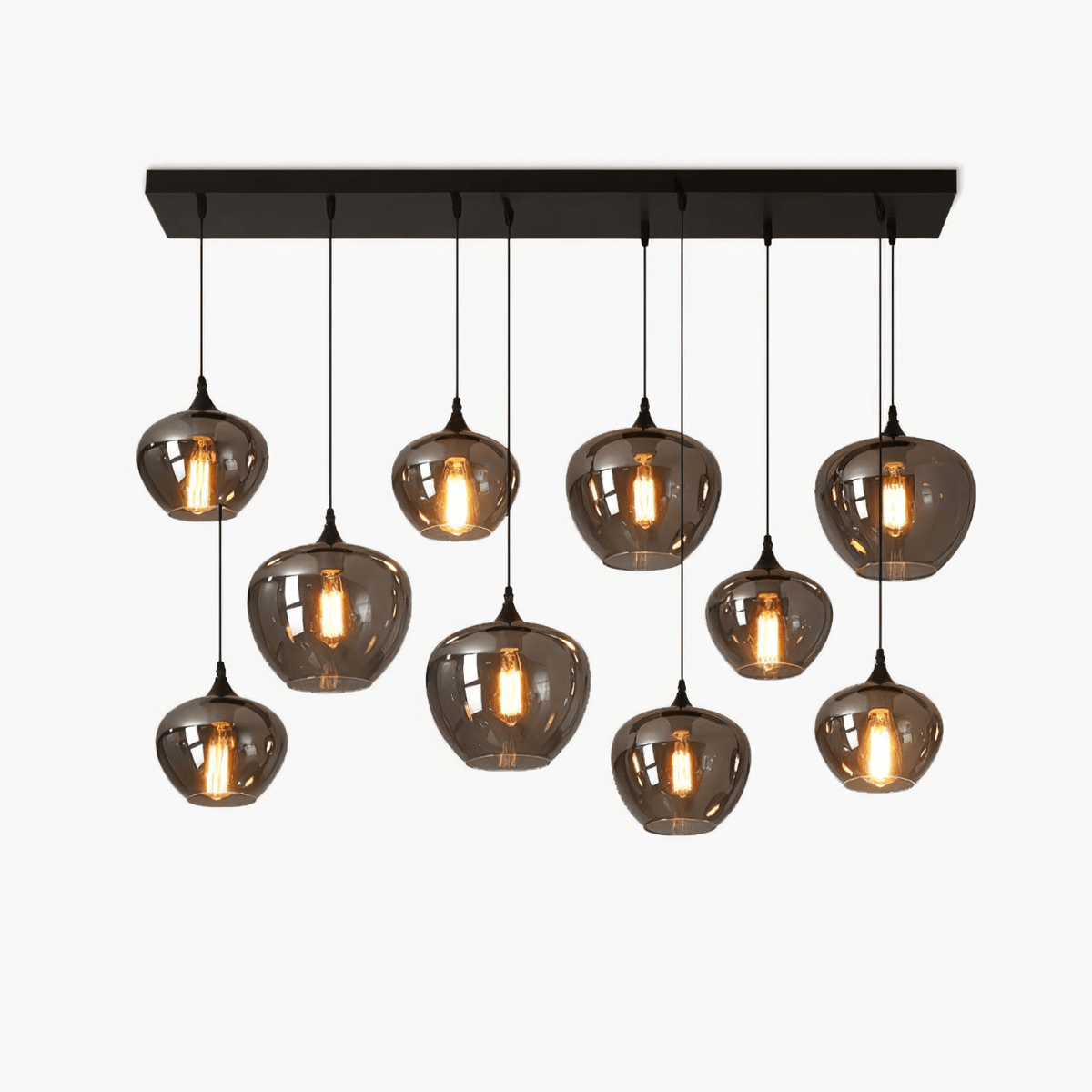 A Clérachic smoke grey glass pendant cluster of ten rounded globes in a row under a black rectangular canopy, lit, on white.