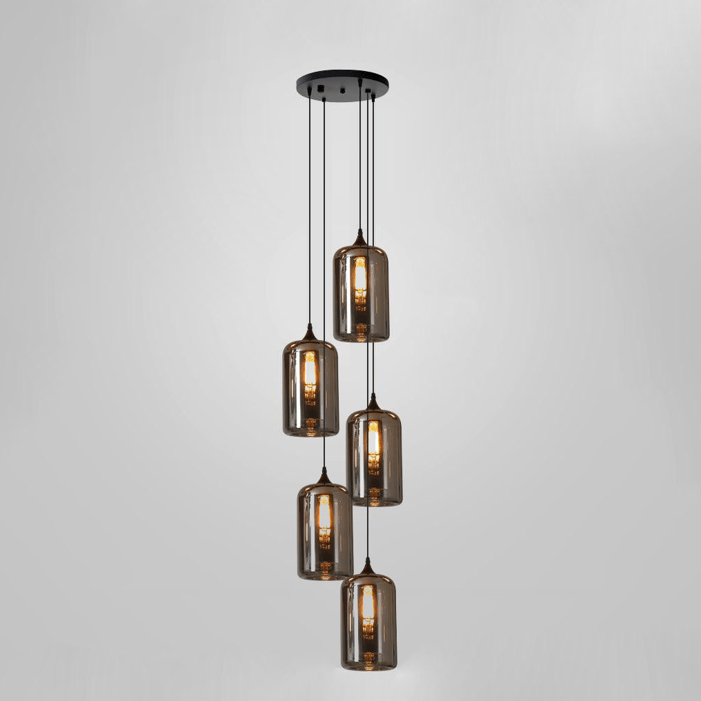 Five tall smoke glass cylinders hang in a vertical cascade from a round black canopy on this Clérachic pendant.