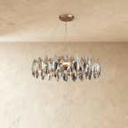 Clérachic round chandelier with a ring of smoked and clear crystal leaves on three fine wires from a brass round canopy.
