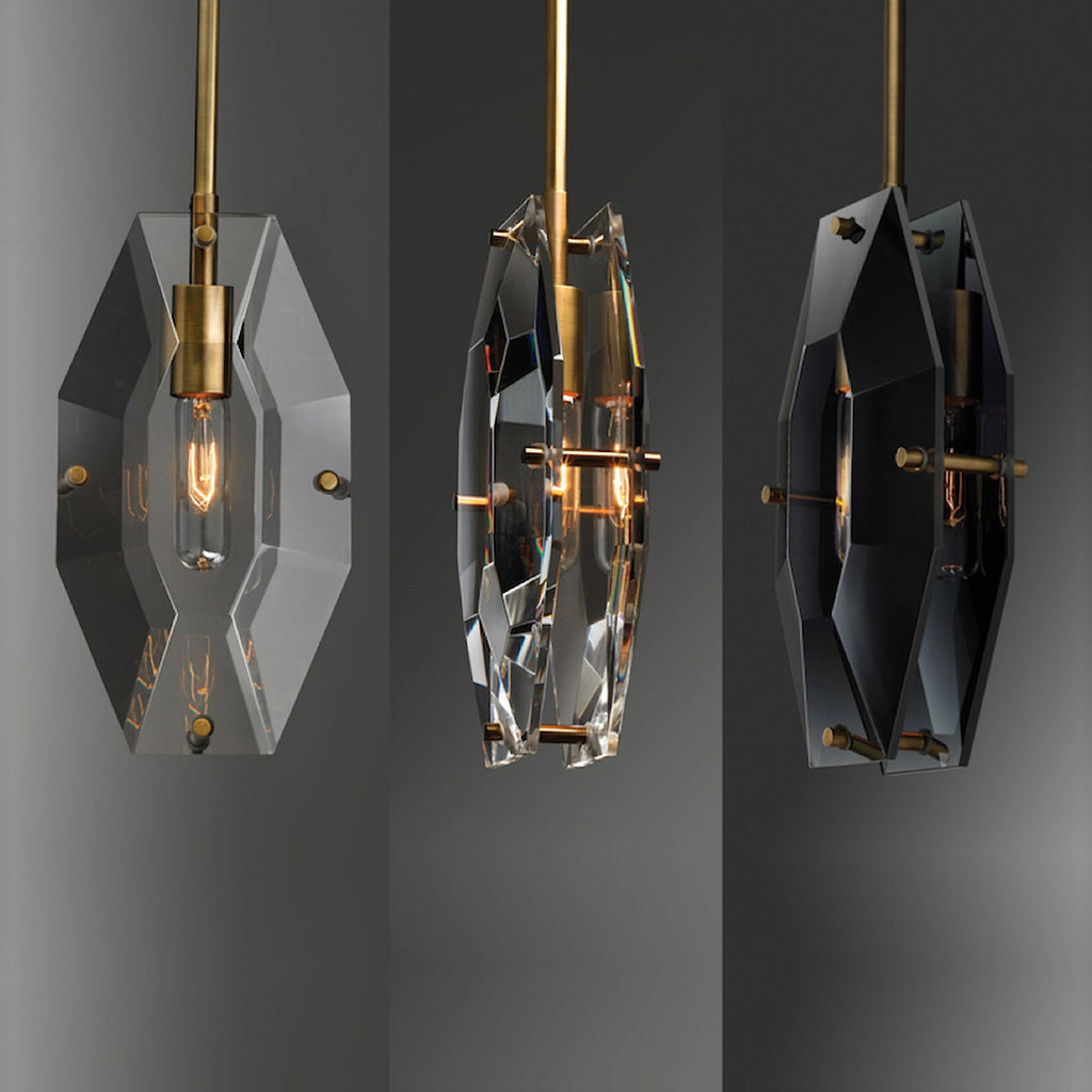 Three views of this Clérachic pendant side by side on grey: front, angled and a darker front view, all with brass fittings.