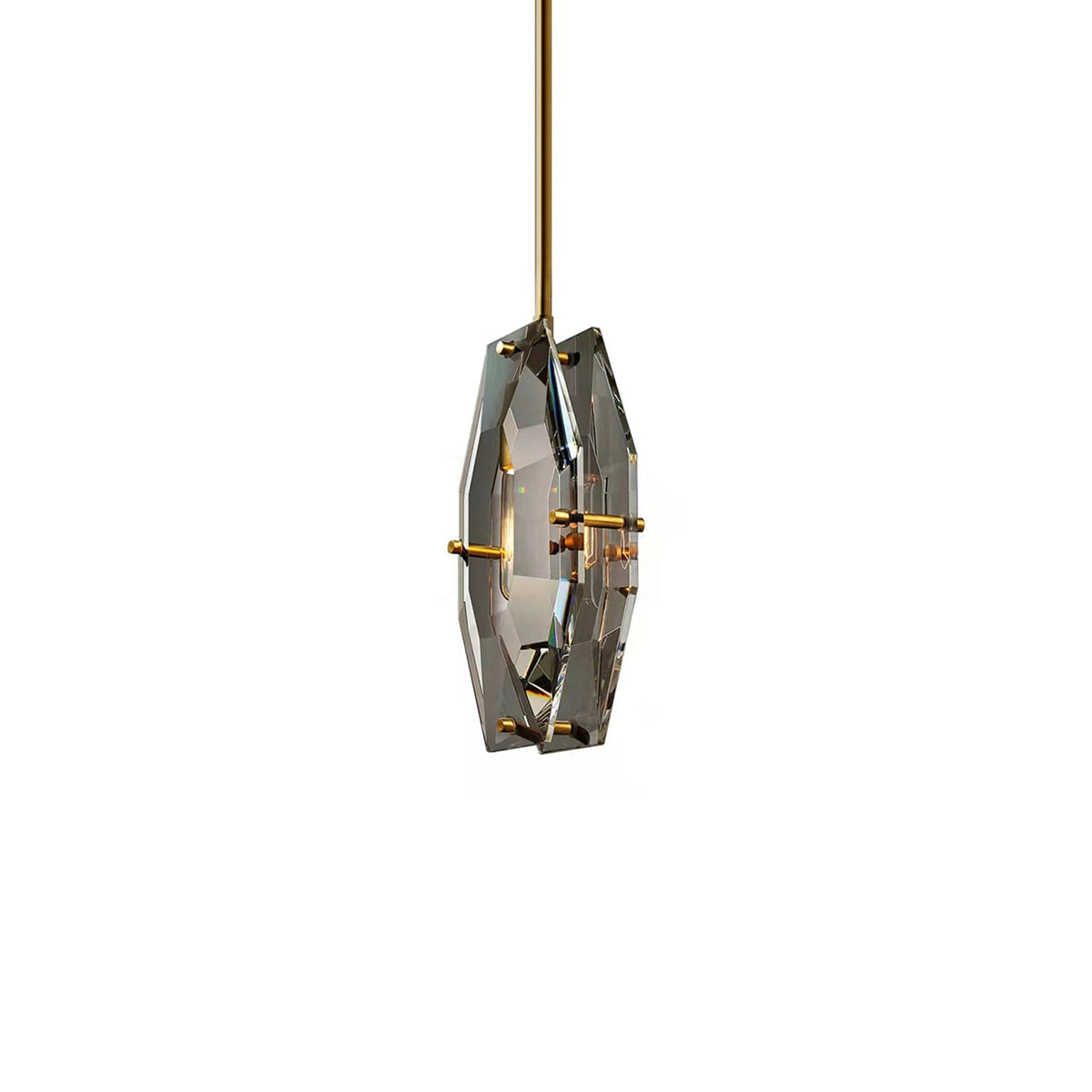 Smaller view of the Clérachic crystal pendant on white, its two brass-pinned panels and a faint bulb glow seen at an angle.