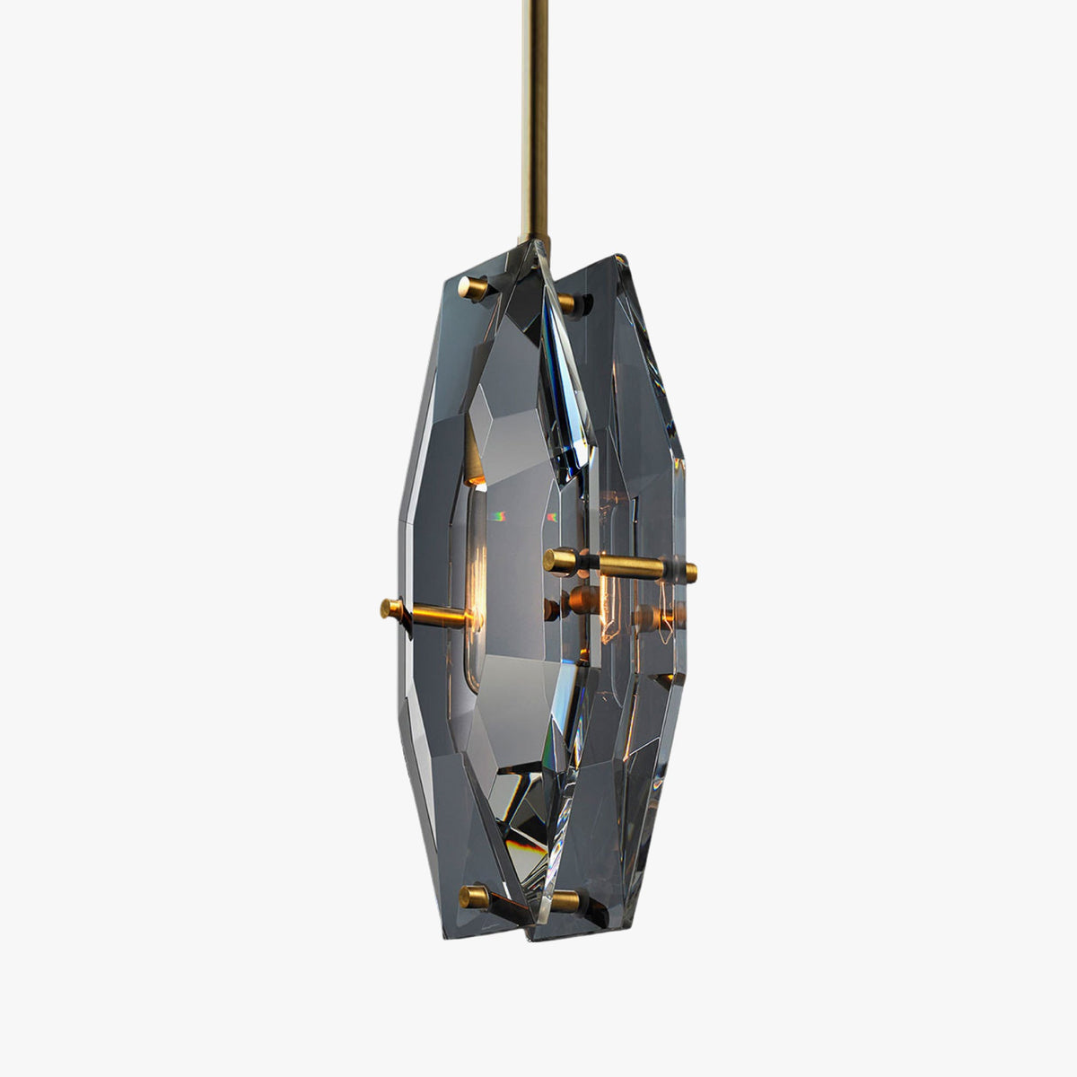 This Clérachic pendant on a light grey backdrop, with its grey-blue cut crystal panels and brass pins seen from a slight angle.