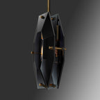 Very dark smoky glass version of this Clérachic pendant, shown edge-on against grey, with brass pins at the panel corners.