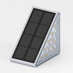 Clérachic grey solar step light shown at an angle, its black solar panel above a triangular LED light bar.