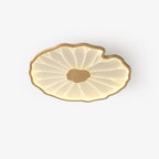 Clérachic ceiling light in light wood-grain finish, photographed on a plain white studio backdrop, lit warm.